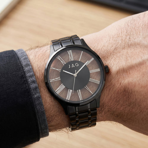 Close-up of man wearing a JAG Gerroa black transparent watch on his wrist.