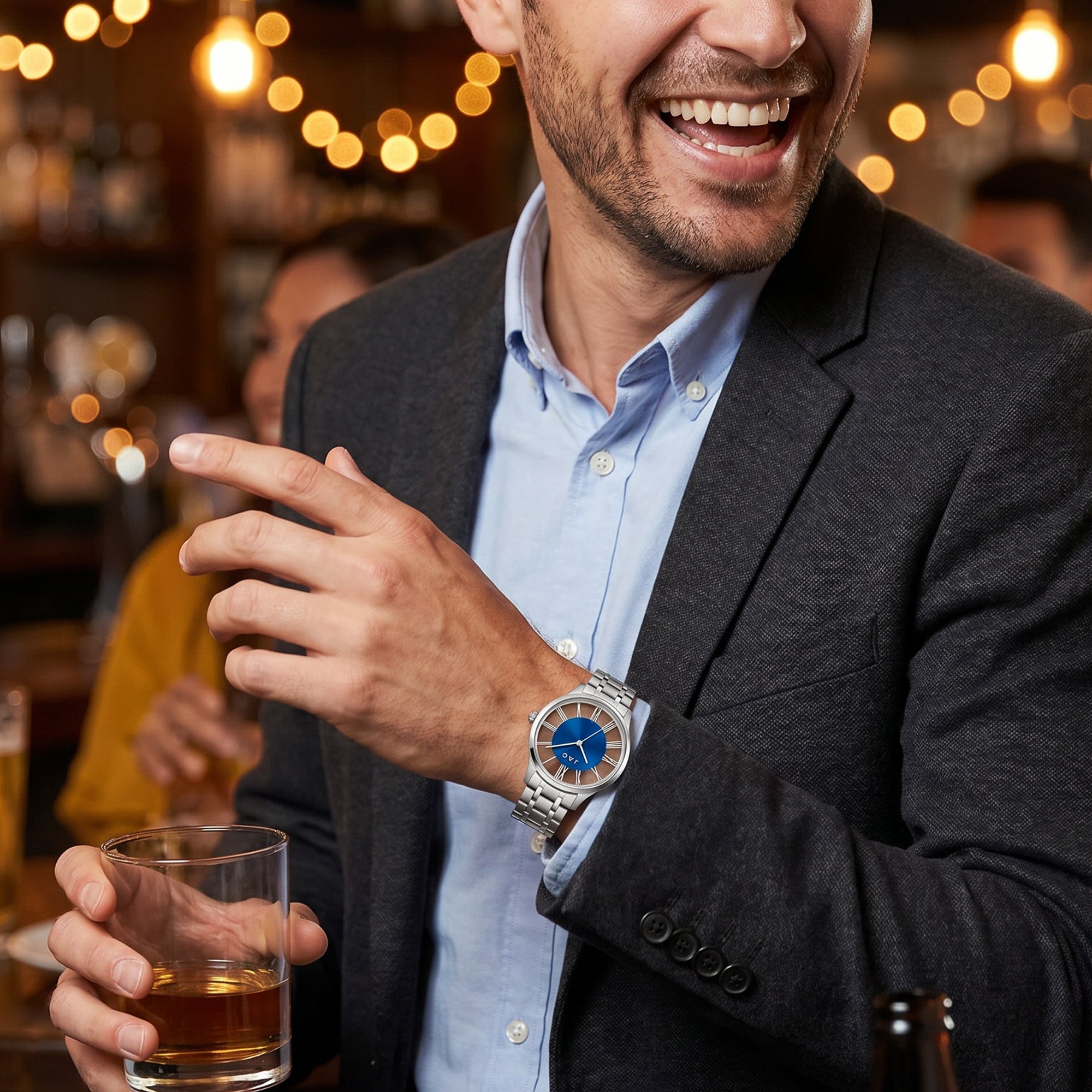 Man wearing a JAG Gerroa silver blue dial transparent watch at a social gathering.