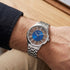 Close-up of man wearing a JAG Gerroa silver blue dial transparent watch on his wrist.