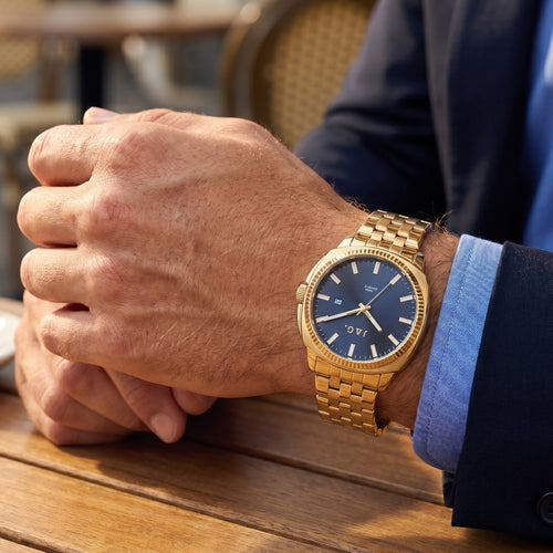 Man wearing Jag Logan gold black dial men's watch.