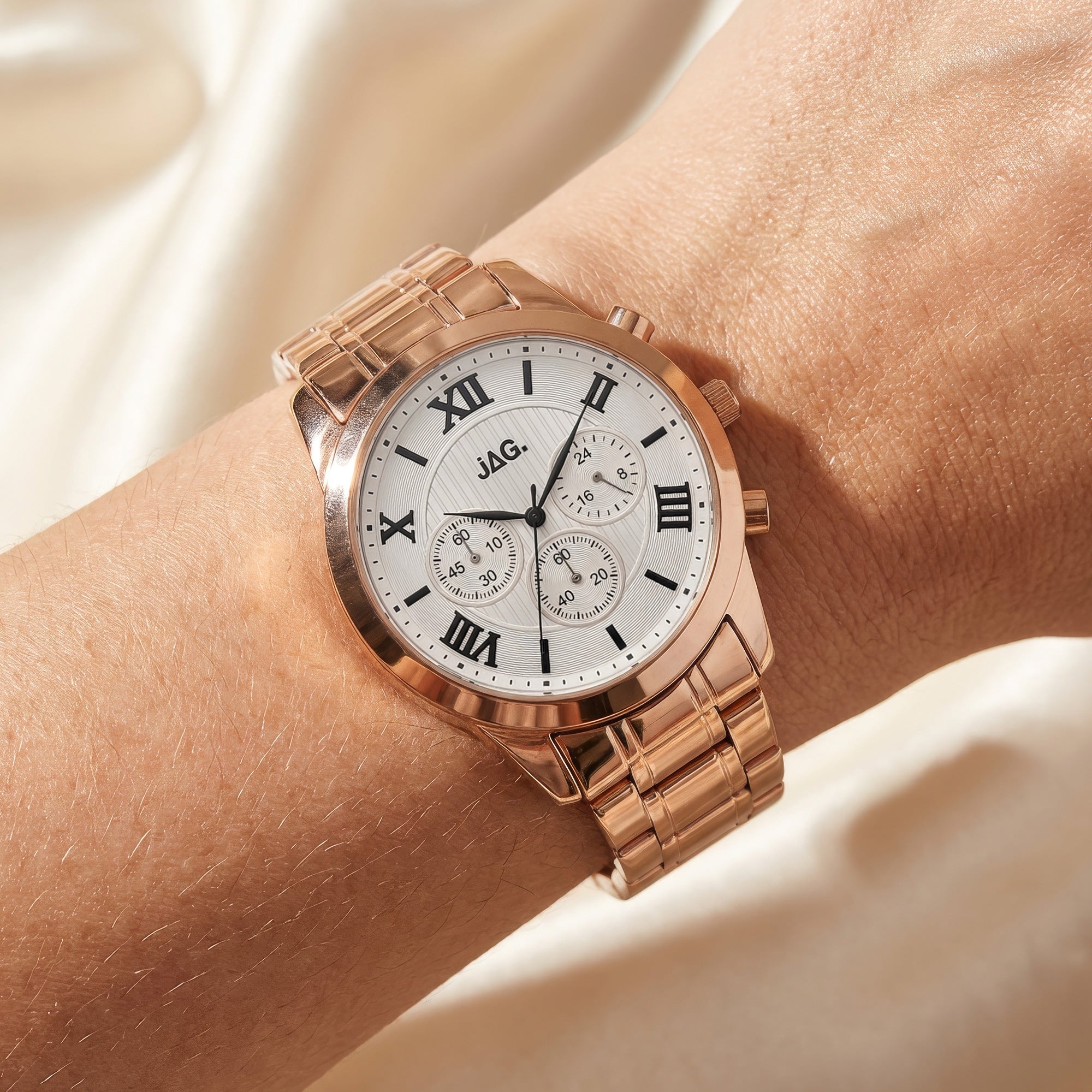 Woman wearing JAG ladies Estelle rose gold watch.