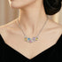 Woman wearing colour gemstone side of Kagi prismatic gemstone reversible statement necklace.