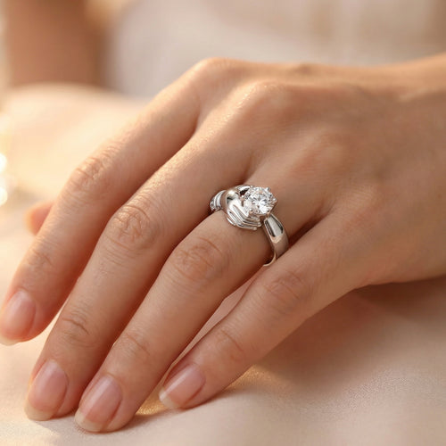 Woman wearing Irish Claddagh solitaire stainless steel ring.