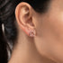 Woman wearing Engelsrufer lotus silver rose gold circle earrings.