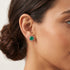 Woman wearing Engelsrufer malachite sterling silver circle earrings.