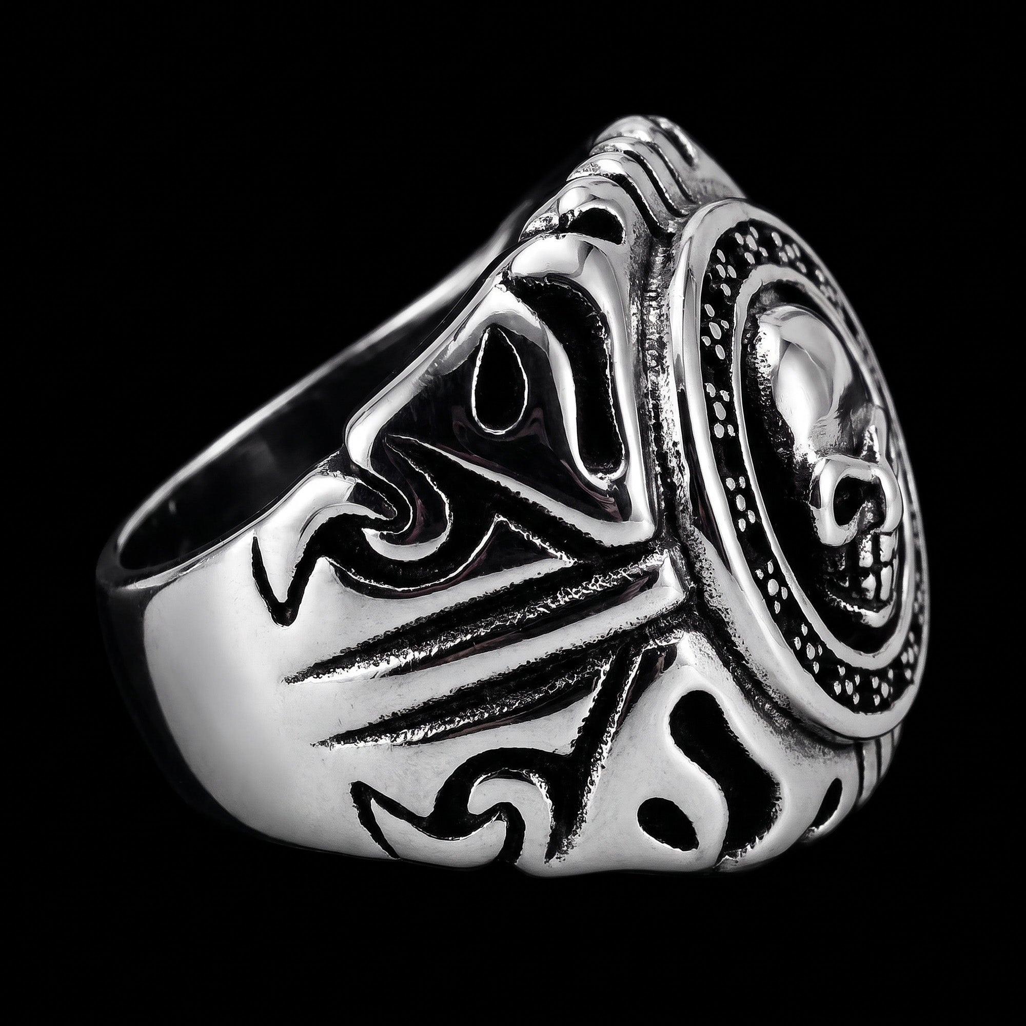Left side view of a memento mori skull stainless steel signet ring.