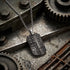 Military star dog tag men's necklace on an industrial metal background.