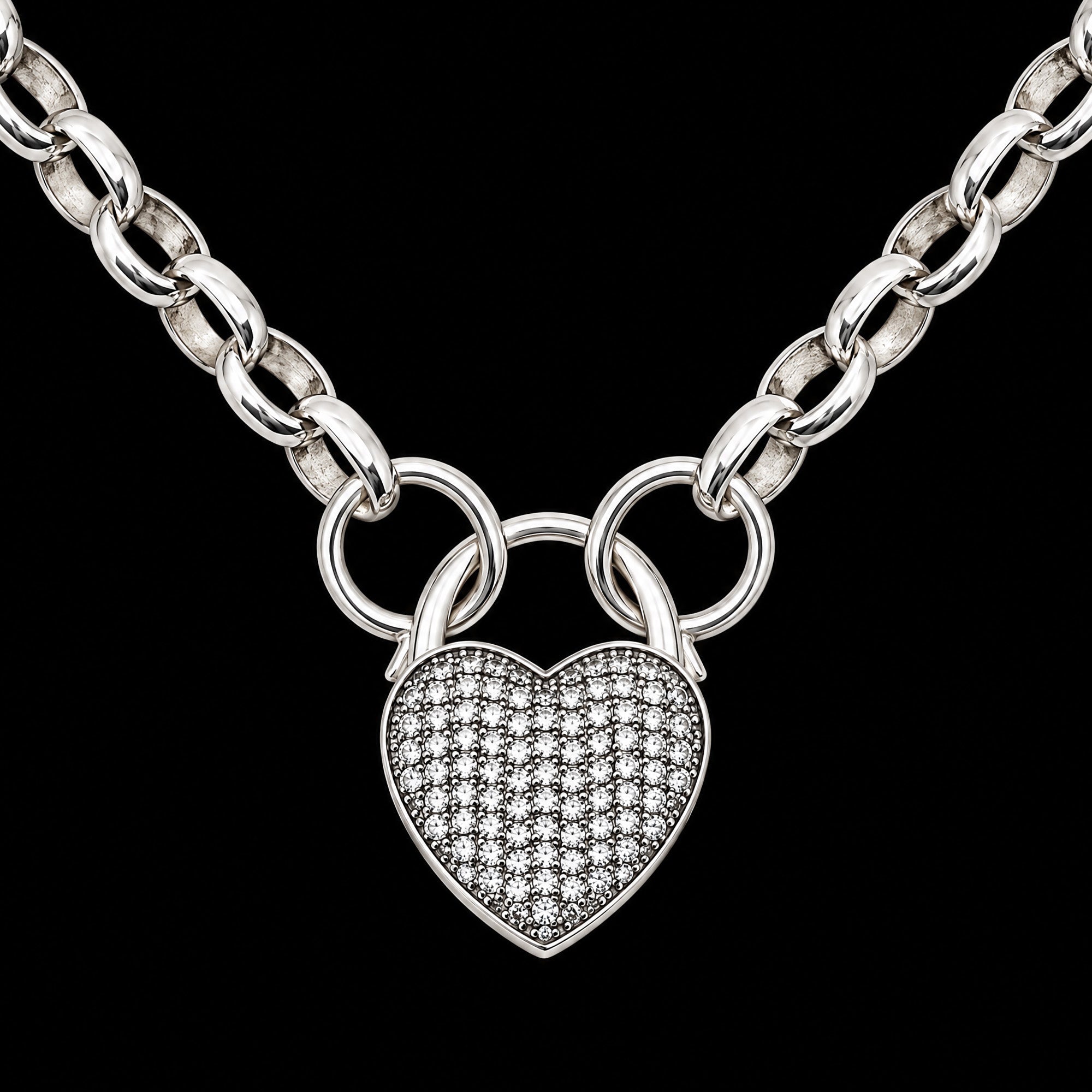 Close-up of a pave heart padlock sterling silver belcher chain necklace.
