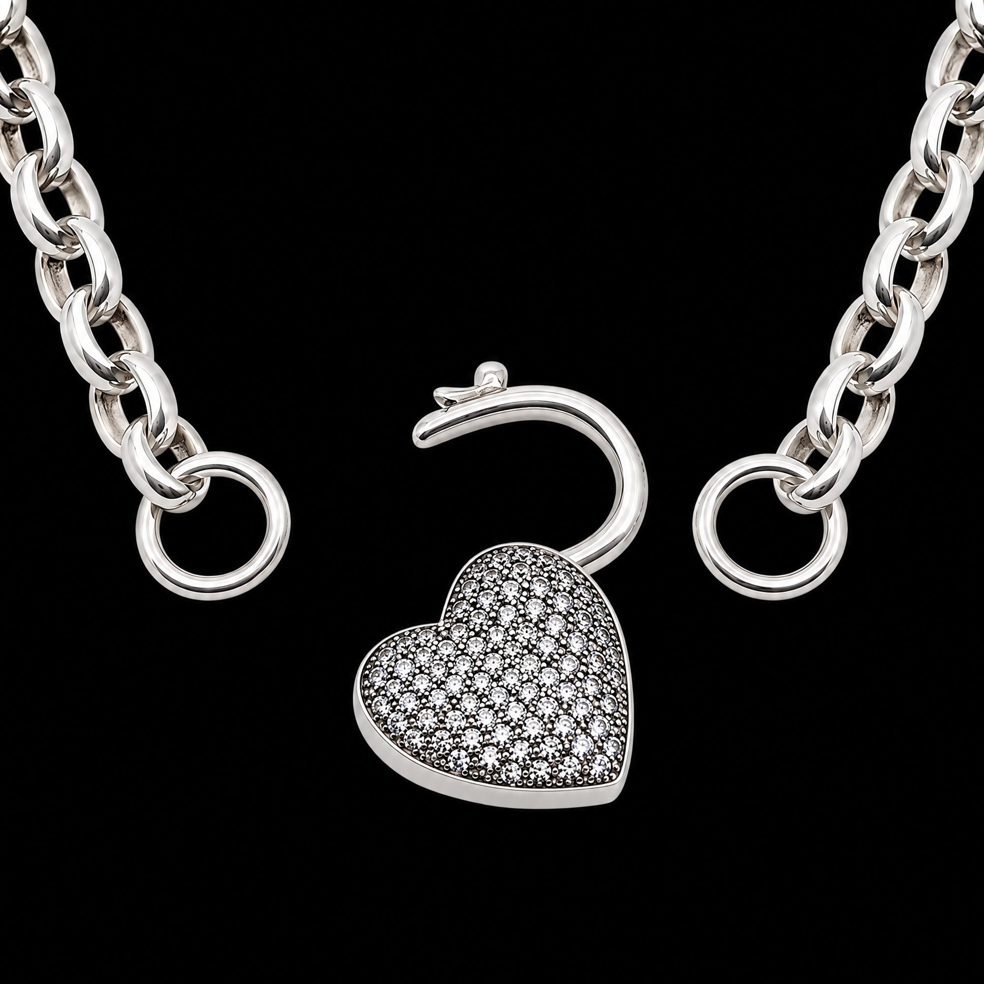 A pave heart padlock sterling silver belcher chain necklace showing the heart locket clasp in the open position.