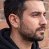 Side profile of man wearing pirate swords stainless steel stud earring.