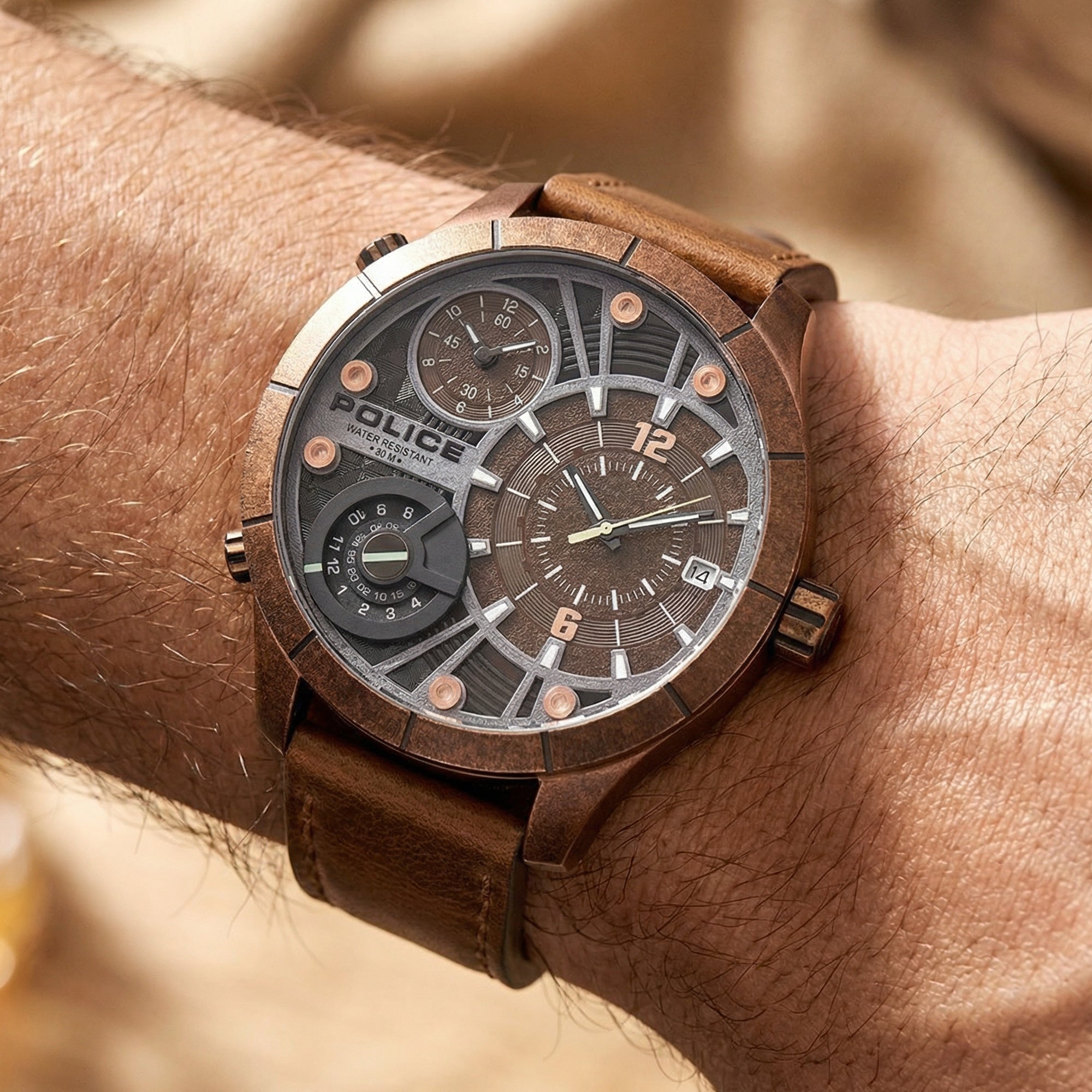 Man wearing Police Bushmaster brown leather men's watch on his wrist.
