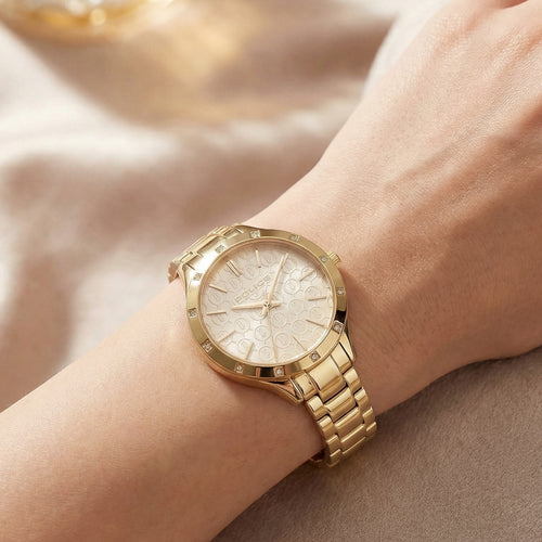 Woman wearing Police ladies Amore gold watch.