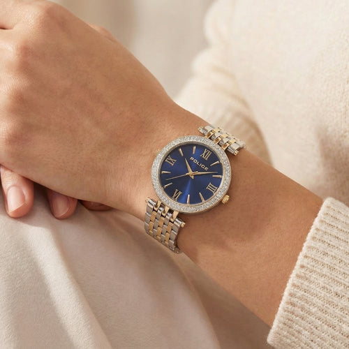 Woman wearing Police ladies Dazzle royal blue dial two tone watch.