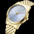 Close-up of Police ladies Celebration powder blue dial gold watch.
