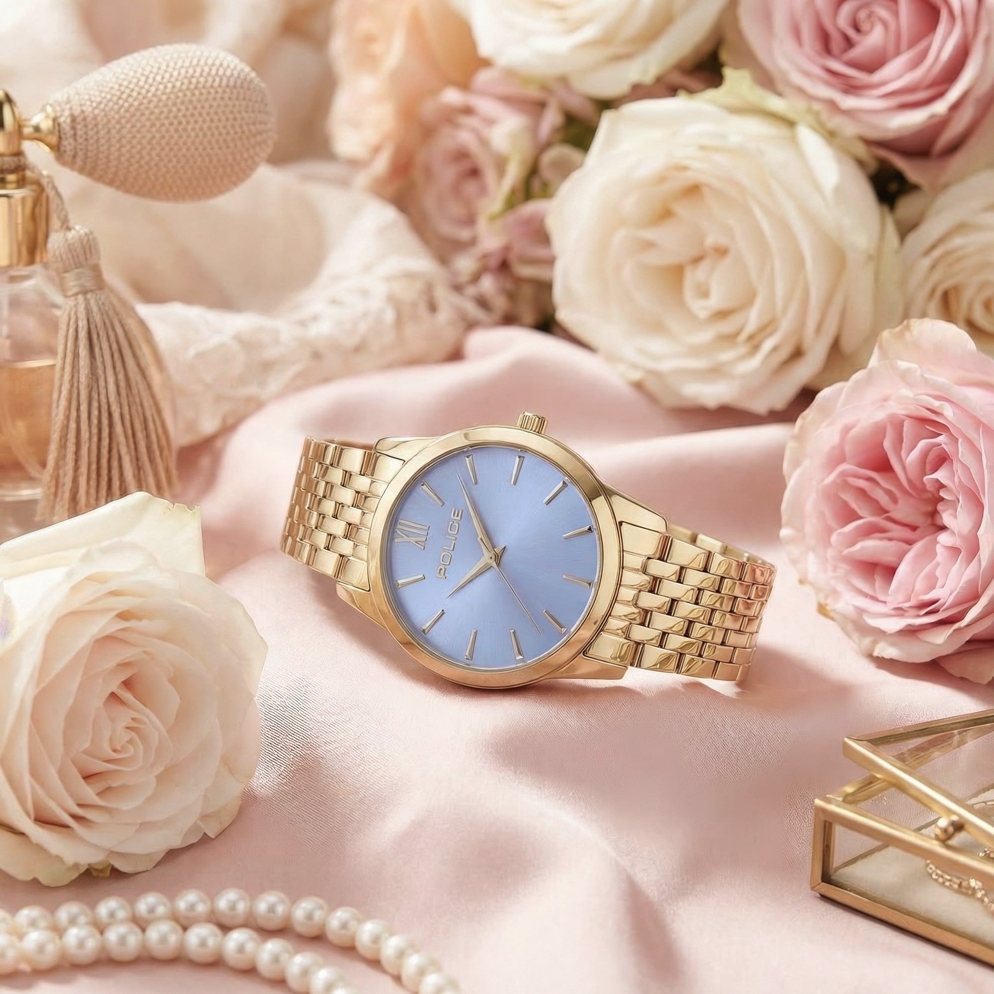 Police ladies Celebration powder blue dial gold watch on pink fabric surrounded by roses.