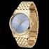Side tilt angle of Police ladies Celebration powder blue dial gold watch.