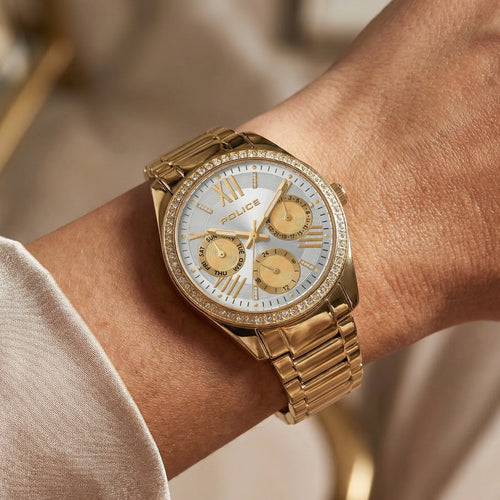 Woman wearing a Police ladies Concerto gold watch.