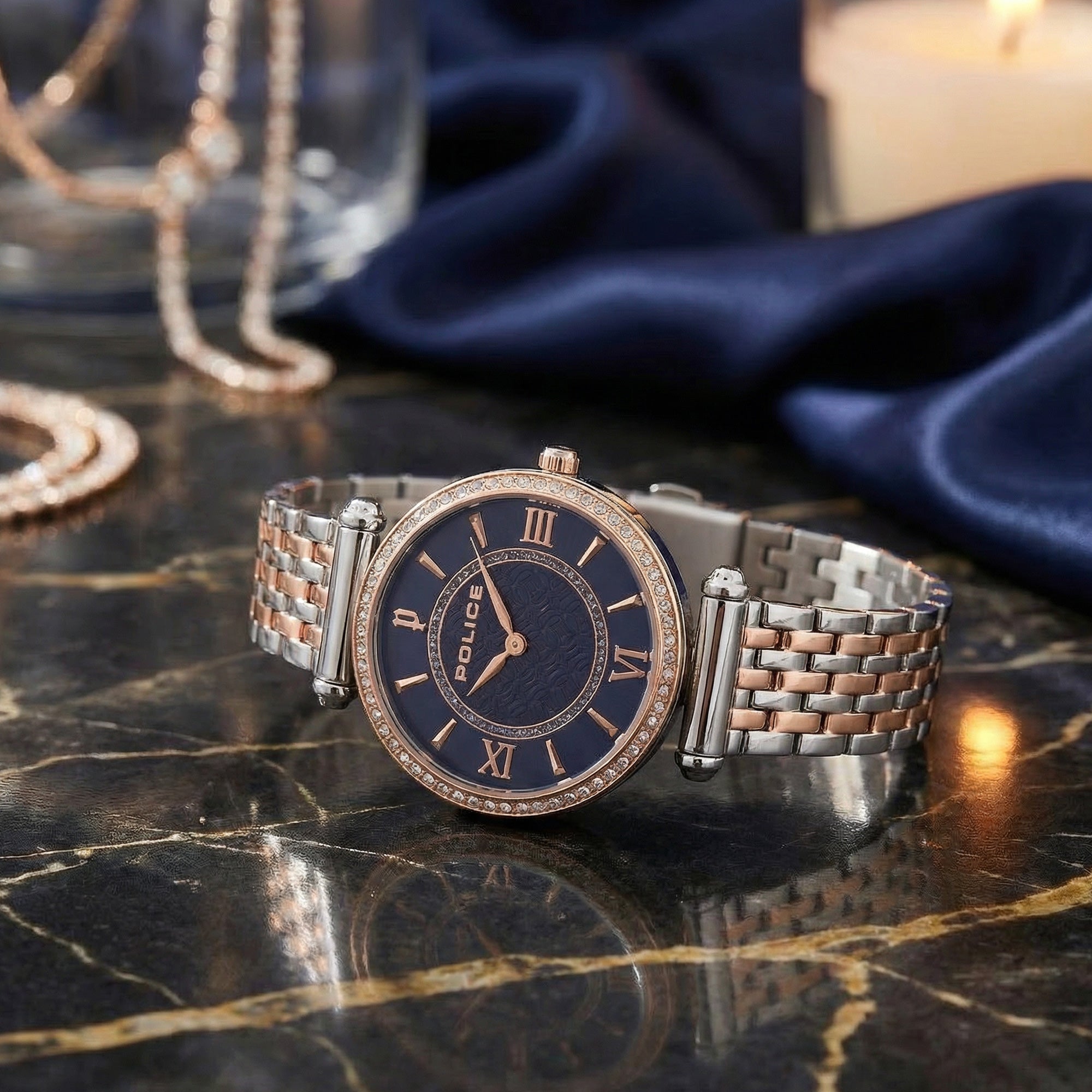 Police ladies Liberty royal blue dial two tone watch on a marble table.