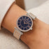 Woman wearing Police ladies Liberty royal blue dial two tone watch.