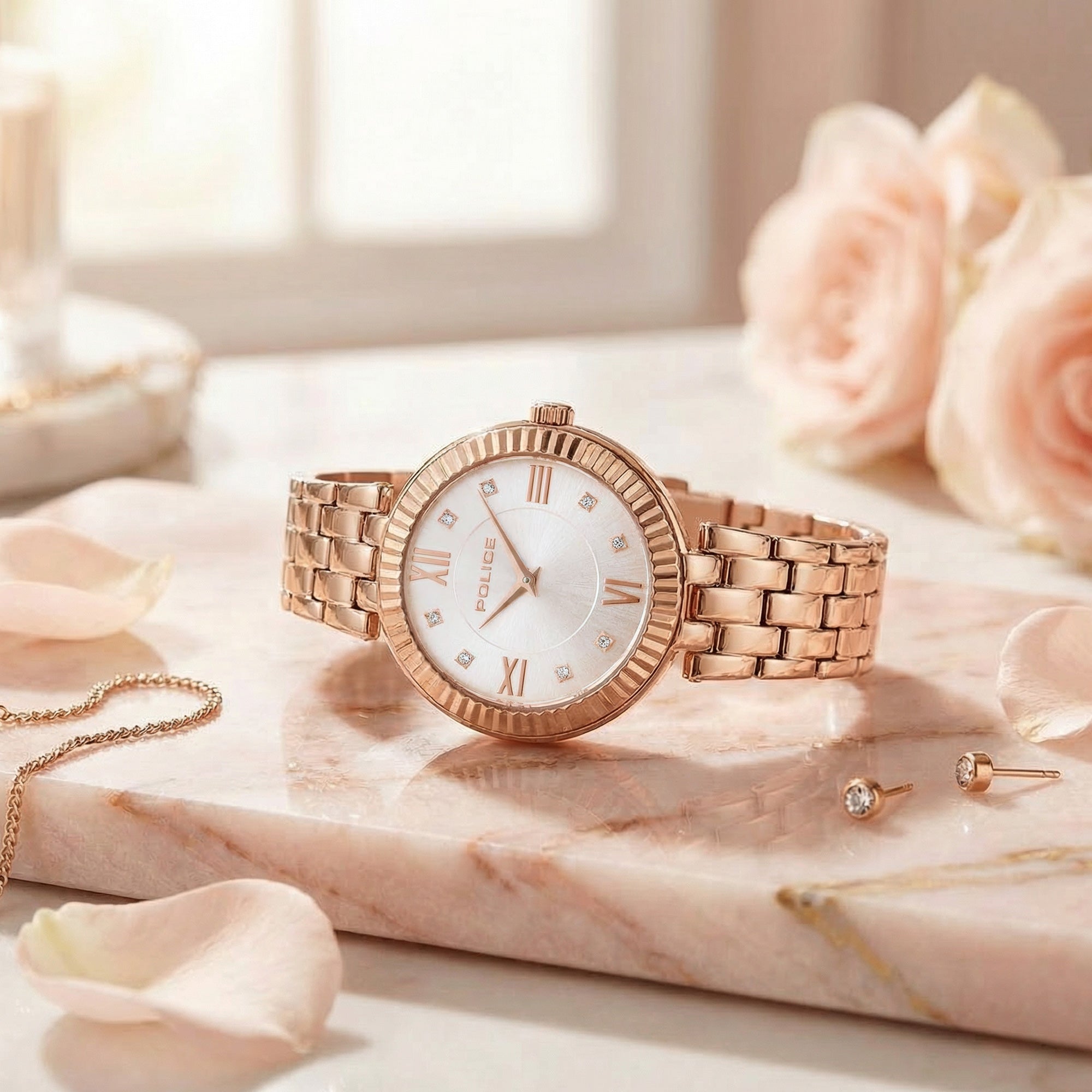 Police ladies Magnificence rose gold watch on marble with roses and jewellery.