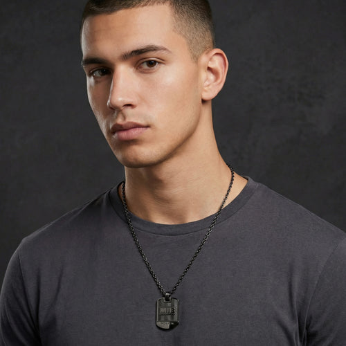 Young man wearing Police Men In Black stainless steel dog tag limited edition necklace.