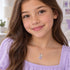 Woman wearing Herzengel purple butterfly nature heart wing silver children's necklace.