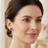 Woman wearing Engelsrufer red jasper sterling silver circle earrings.