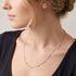 Side view of woman wearing Engelsrufer rose gold 80cm CZ chain necklace.