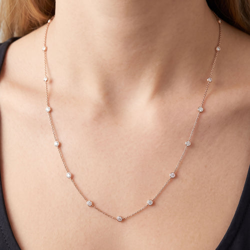 Woman wearing Engelsrufer rose gold 80cm CZ chain necklace.