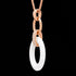 Tilt side view of a sterling silver rose gold white ceramic oval link CZ necklace.