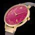 Side view of Sara Miller Chelsea Birds 34mm pink dial gold watch.