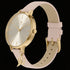 Sara Miller Chelsea Charm 34mm sunray dial gold watch tilted to the left.