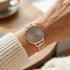 Woman wearing Sara Miller Chelsea Charm 34mm mocha rose gold mesh watch.