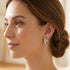 Woman looking to the left and wearing Engelsrufer sterling silver 20mm CZ hoop earrings.
