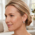 Woman looking to the left and wearing Engelsrufer sterling silver 20mm hoop earrings.