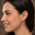 Side view of woman wearing Engelsrufer sterling silver 24mm hoop earrings.