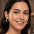 Woman wearing Engelsrufer sterling silver 24mm hoop earrings.