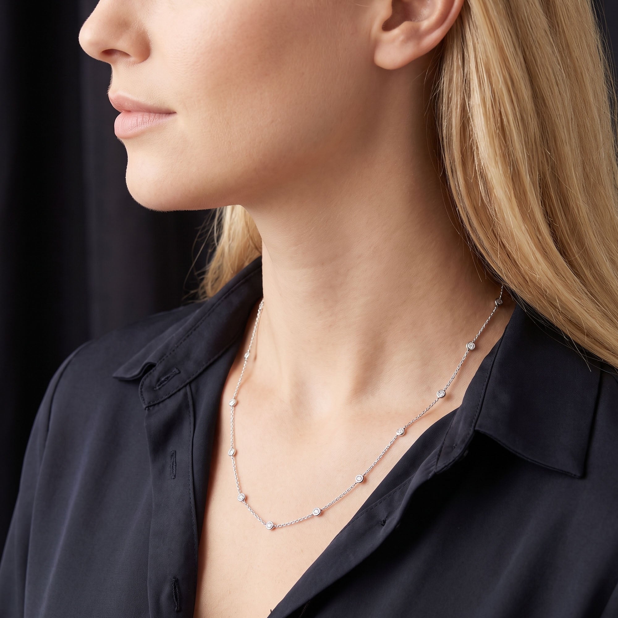 Side view of woman wearing Engelsrufer silver 80cm CZ chain necklace.