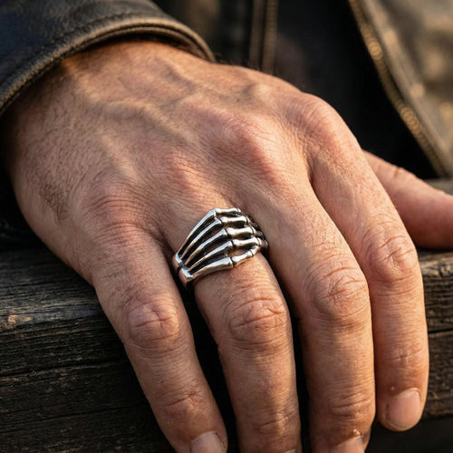 Man wearing stainless steel men's skeletal hand ring.