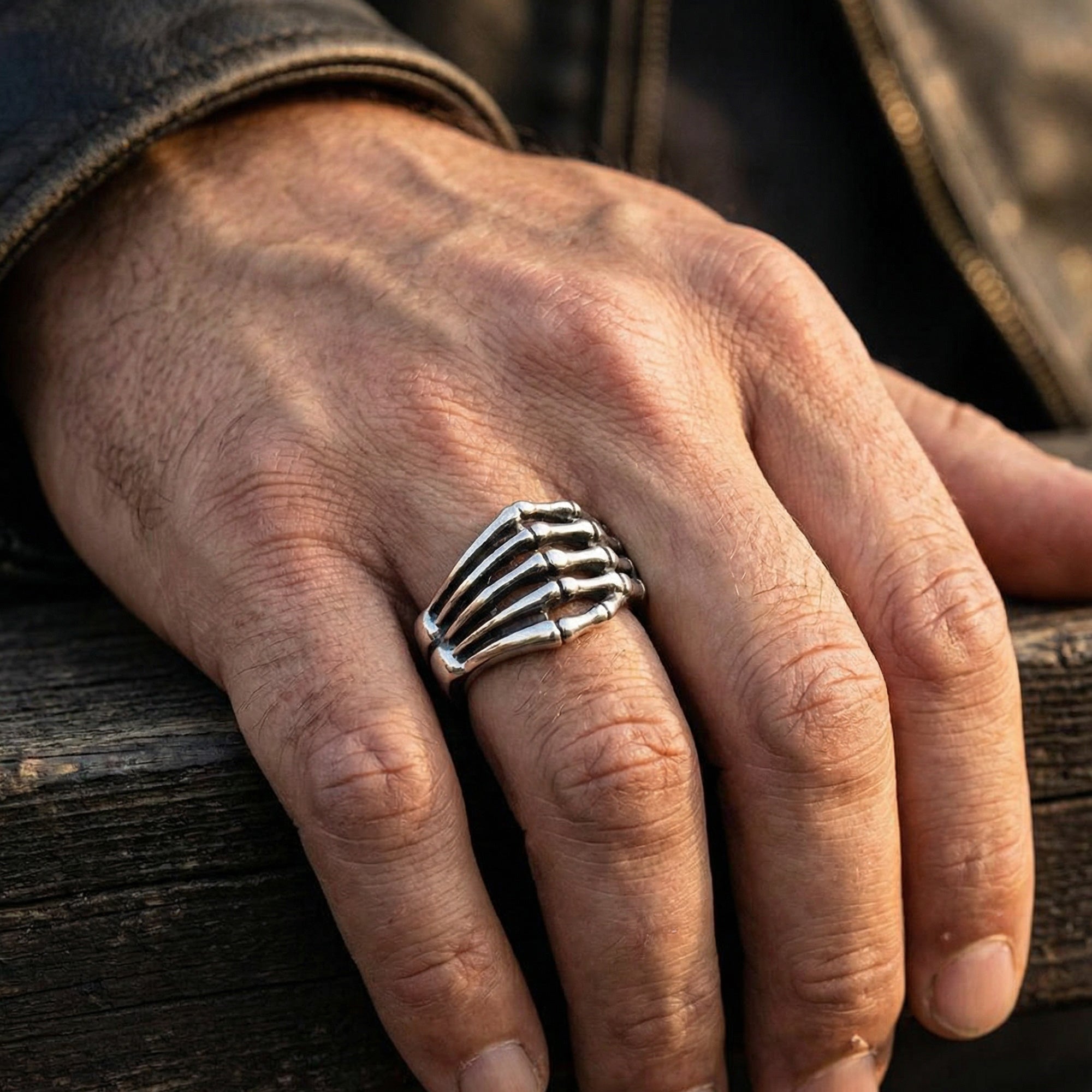 Man wearing stainless steel men's skeleton hand ring.