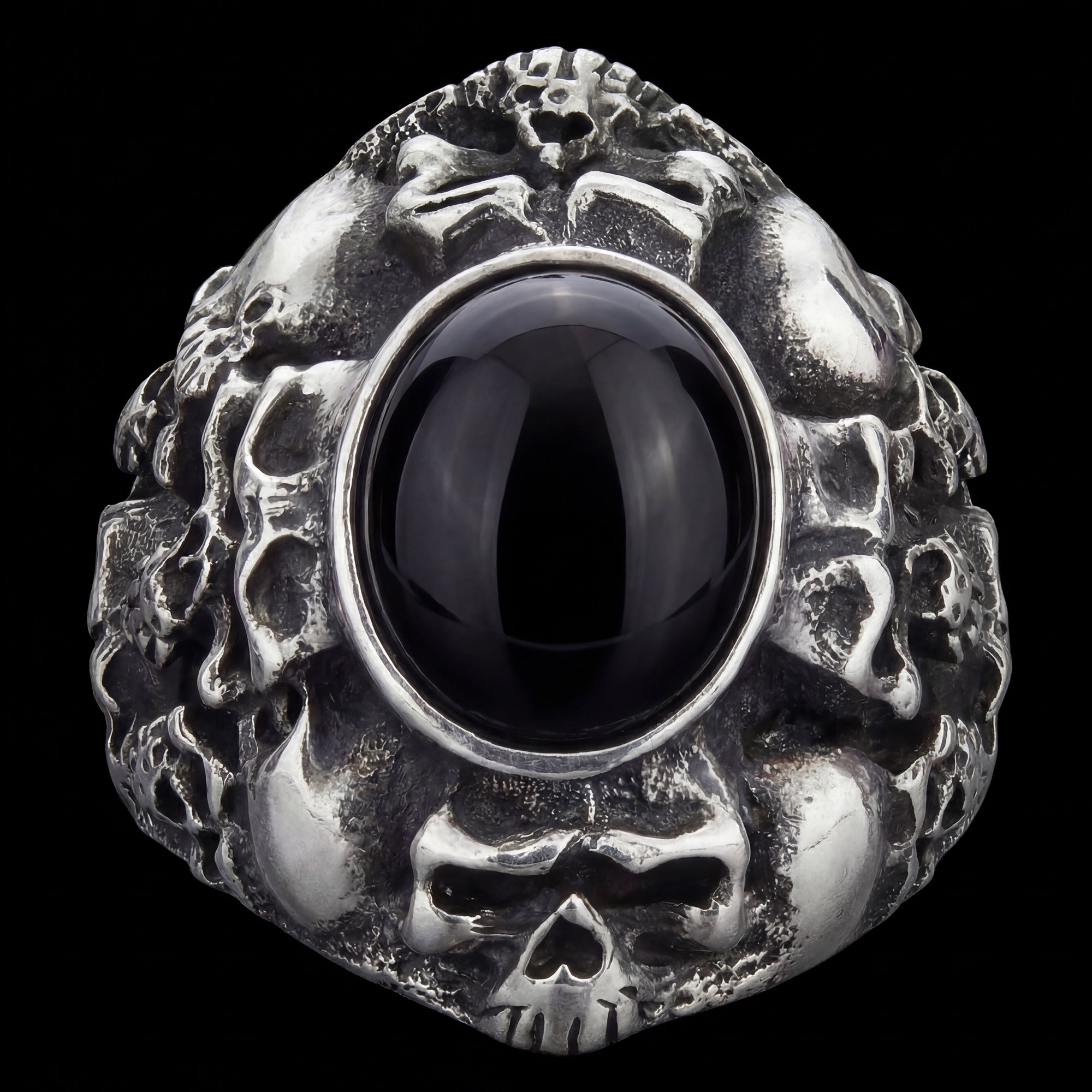 Front facing view of memento mori skull cluster stainless steel men's ring.