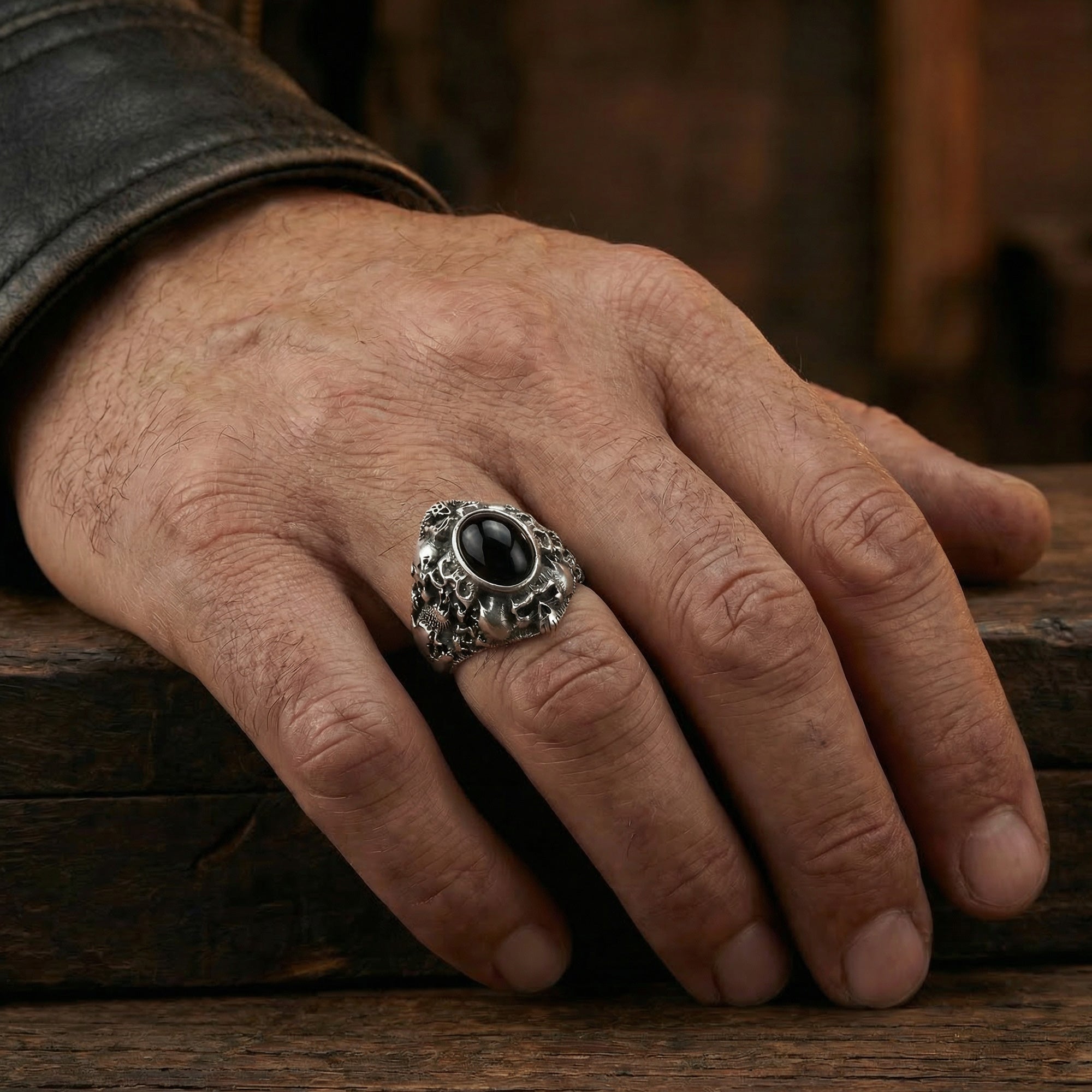 Man wearing memento mori skull cluster stainless steel men's ring.