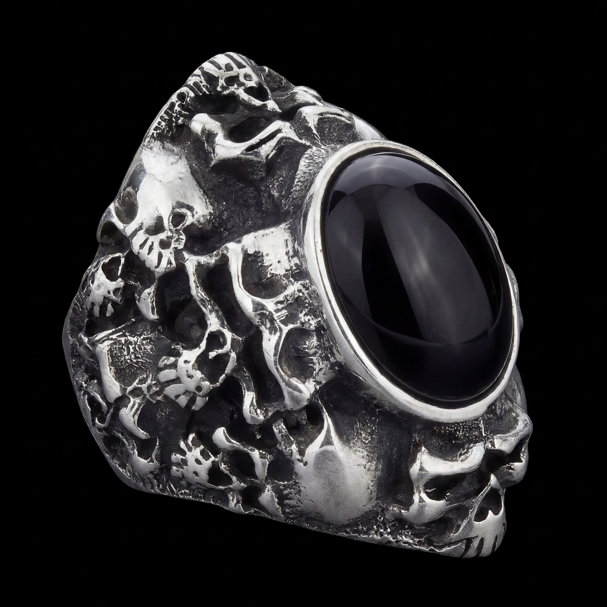Memento Mori skull cluster stainless steel men's ring tilted to the right.