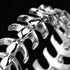 Close-up of a men's stainless steel spine vertebrae ring.