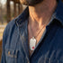 Close-up of man wearing medical alert stainless steel matt finish dog tag necklace.