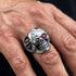 Close up man wearing stainless steel men's skull eye patch ring.