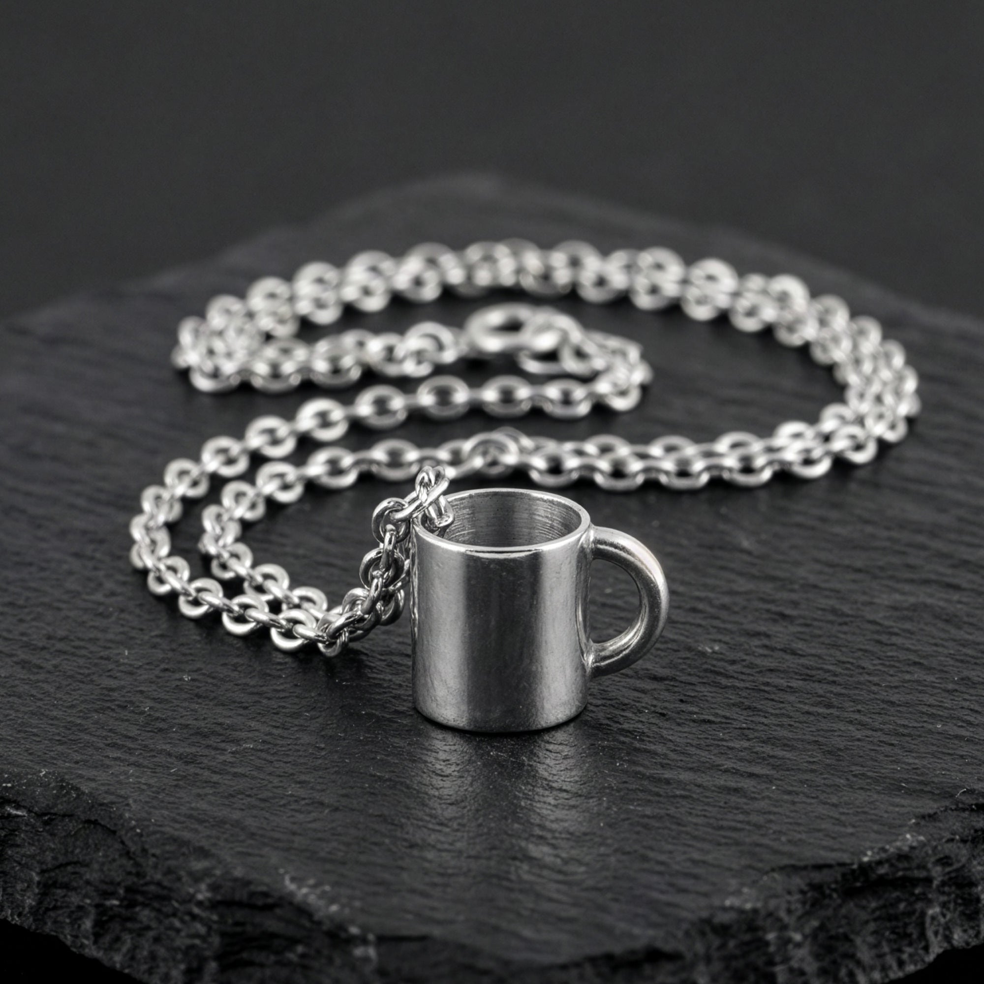 Anchor & Crew coffee mug sterling silver necklace on black slate.
