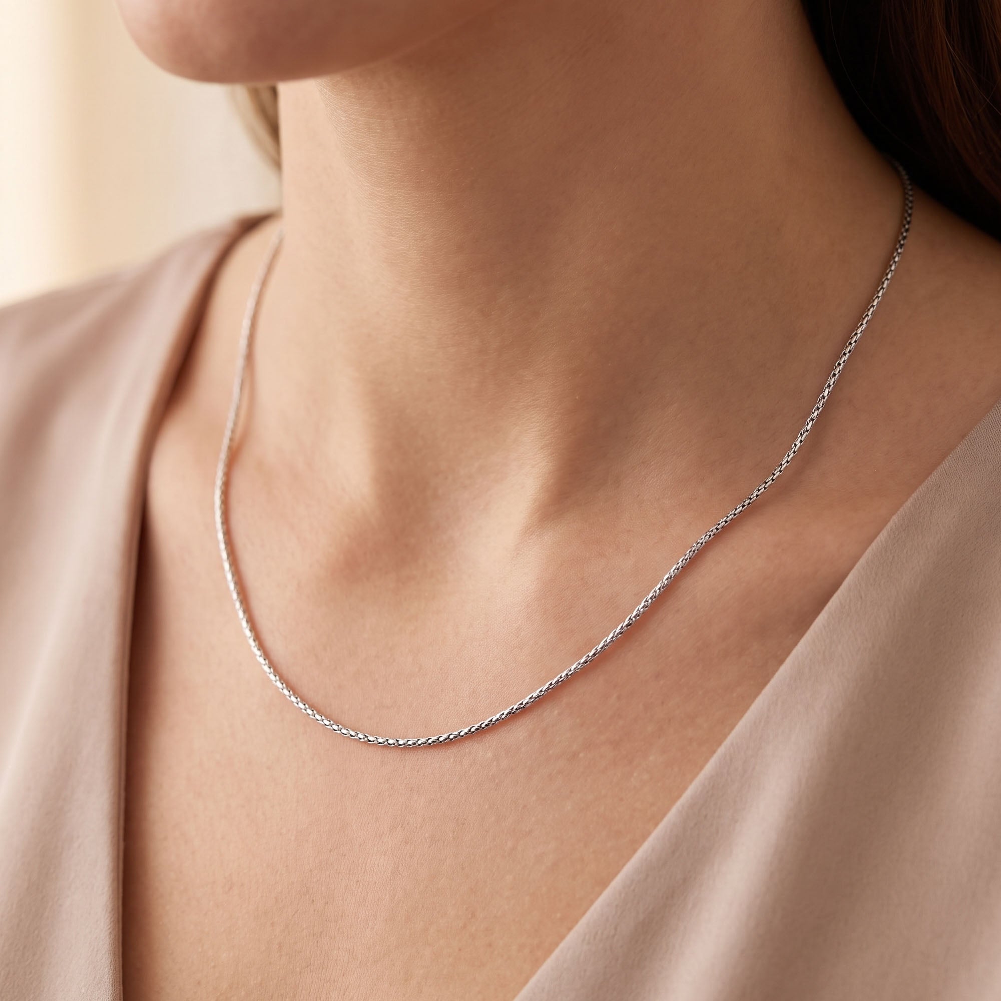 Woman wearing Engelsrufer sterling silver 1.5mm Korean chain necklace.