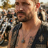 Close up of a biker man wearing a sugar skull sterling silver men's necklace.