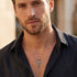 Man in open-neck shirt wearing Thomas Sabo cross of life ankh scarab pendant.